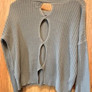 Blue sweater with cutout of back